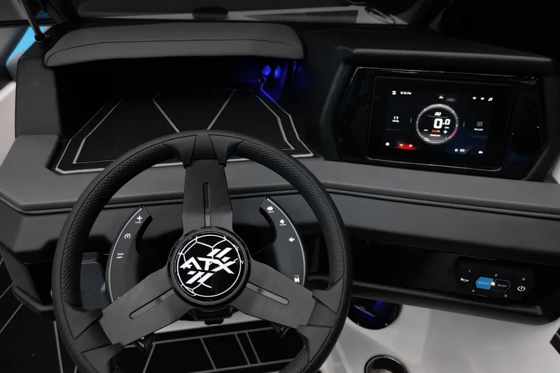 Slide: The Image of 2026 ATX Surf Boats 22 Type-S dashboard with steering wheel and digital display. - 16