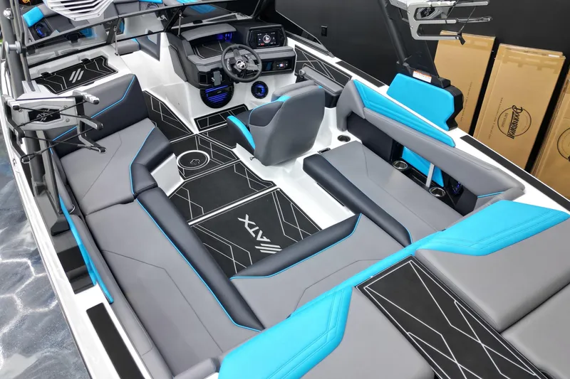 Slide: The Image of 2026 ATX Surf Boats 22 Type-S interior with modern design, blue and gray seating, and advanced dashboard. - 18