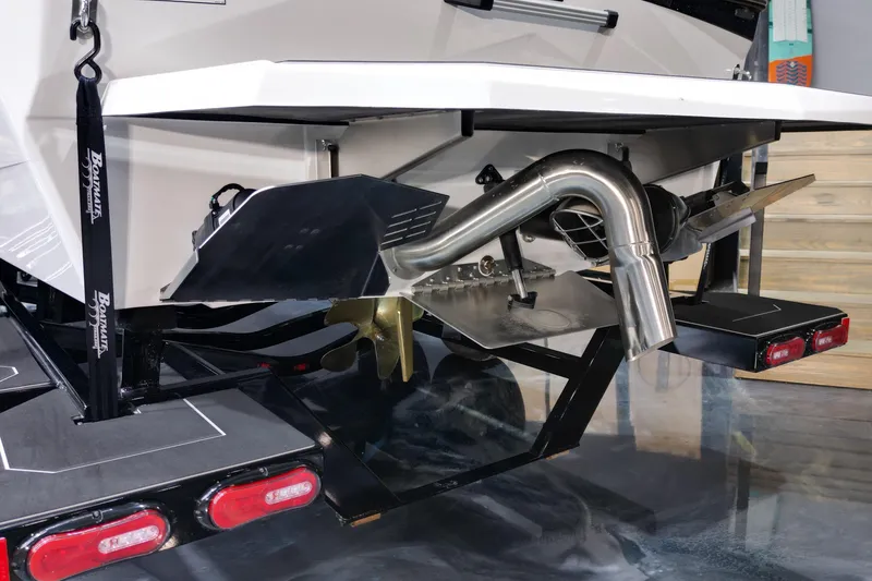 Slide: The Image of 2026 ATX Surf Boats 22 Type-S rear view, showcasing exhaust and propeller system. - 20