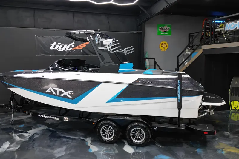 Slide: The Image of 2026 ATX Surf Boats 22 Type-S in showroom, featuring sleek design and modern graphics. - 4