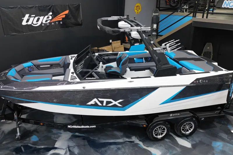 Slide: The Image of 2026 ATX Surf Boats 22 Type-S, sleek design with blue accents, displayed indoors. - 7