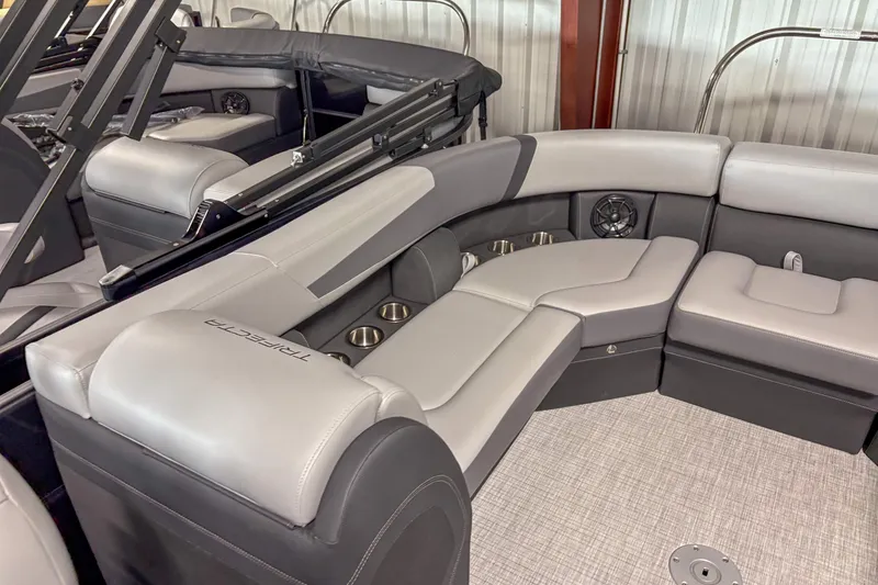 Slide: The Image of 2025 Trifecta 24 RF CS boat interior with luxurious seating and cup holders. - 10