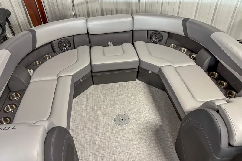 Slide: The Image of 2025 Trifecta 24 RF CS boat interior with luxurious seating and cup holders. - 12