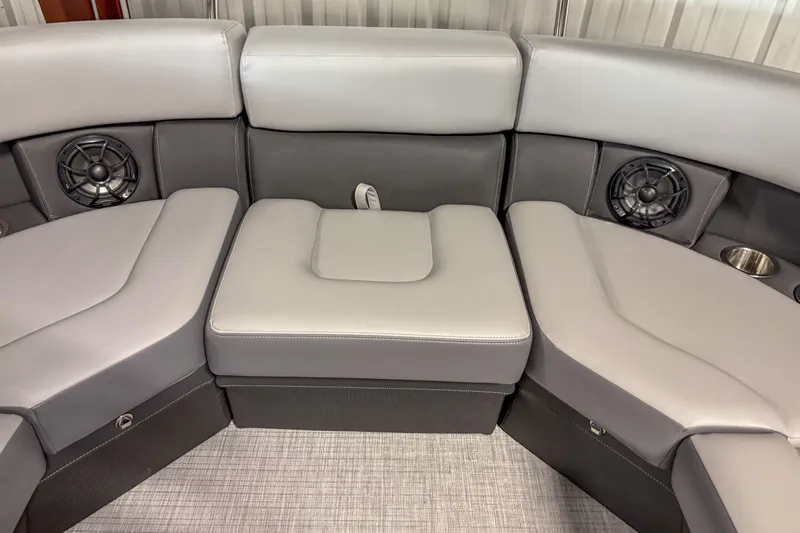 Slide: The Image of 2025 Trifecta 24 RF CS boat interior with gray seating and built-in speakers. - 13