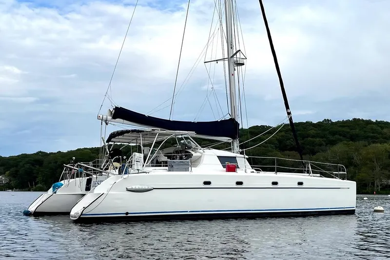 The Image of Sailing catamaran Fountaine Pajot Belize 43, 2000 model, anchored on calm water. - 0