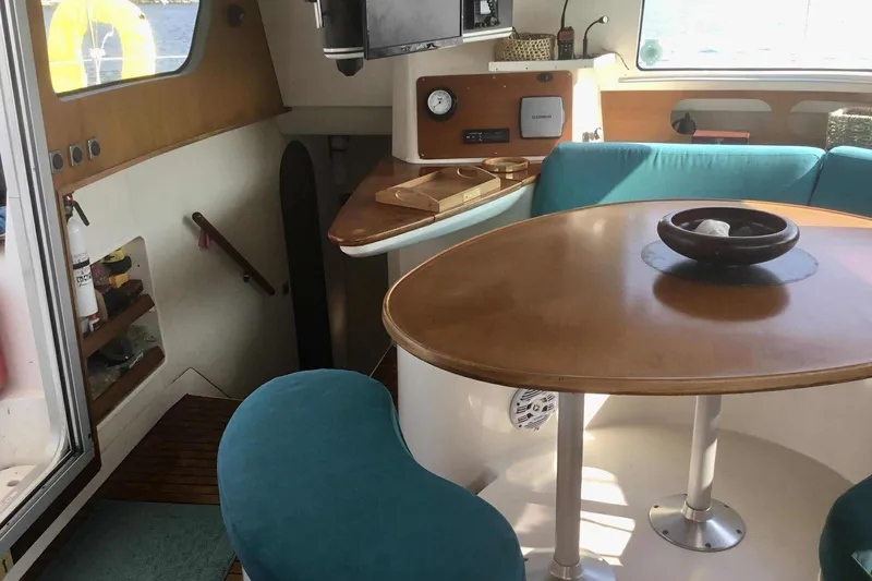 Slide: The Image of Compact kitchen area in a 2000 Fountaine Pajot Belize 43 catamaran, featuring dual sinks and stove. - 13
