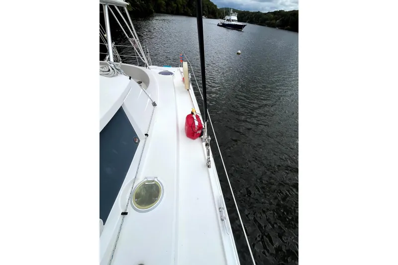 Slide: The Image of Interior of 2000 Fountaine Pajot Belize 43 catamaran with cozy seating and dining area. - 16