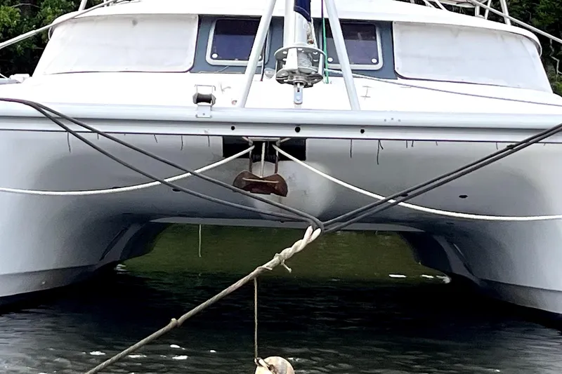 Slide: The Image of Fountaine Pajot Belize 43 catamaran, 2000 model, anchored in calm waters. - 27