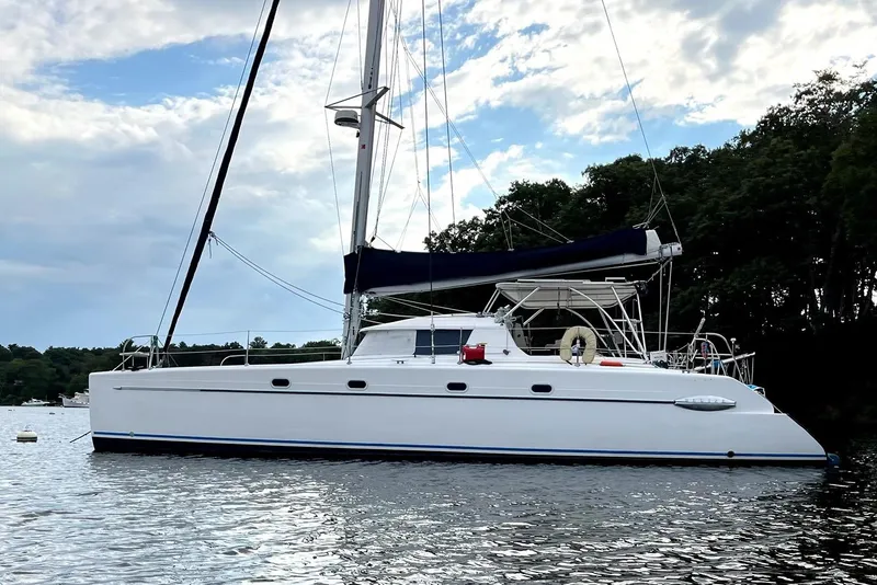 Slide: The Image of Sailing catamaran Fountaine Pajot Belize 43, 2000 model, anchored on calm water. - 3