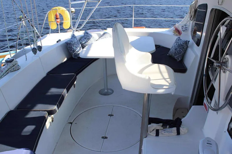 Slide: The Image of Cockpit of 2000 Fountaine Pajot Belize 43 catamaran with seating and steering wheel. - 8