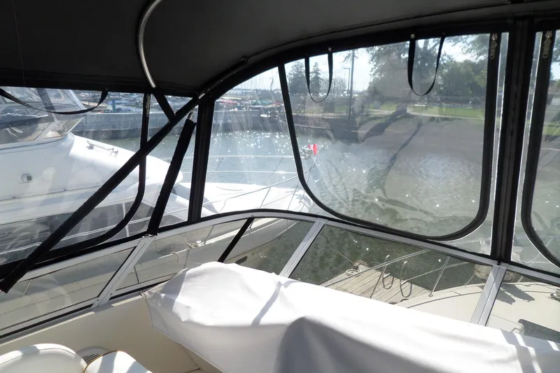 Slide: The Image of Interior view of 2000 Sea Ray 380 Aft Cabin yacht docked at marina. - 11
