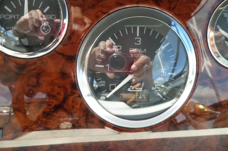Slide: The Image of Close-up of 2000 Sea Ray 380 Aft Cabin boat dashboard with RPM gauge. - 115