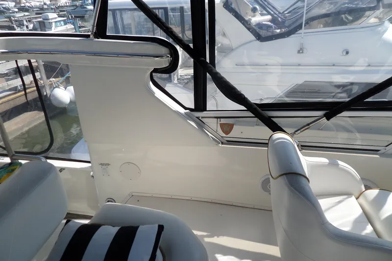 Slide: The Image of Interior view of a 2000 Sea Ray 380 Aft Cabin yacht at a marina. - 12