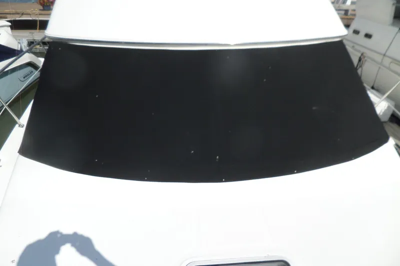 Slide: The Image of 2000 Sea Ray 380 Aft Cabin yacht with black windshield cover. - 120