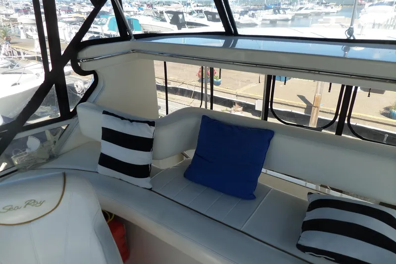 Slide: The Image of Interior of 2000 Sea Ray 380 Aft Cabin with striped and blue cushions. - 15