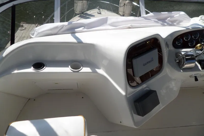 Slide: The Image of Cockpit of 2000 Sea Ray 380 Aft Cabin with Garmin navigation system and controls. - 16