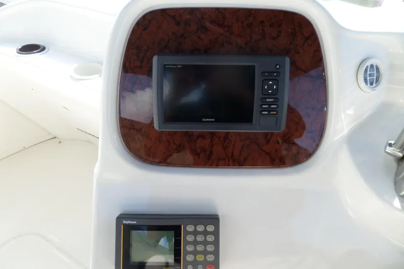 Slide: The Image of Control panel of 2000 Sea Ray 380 Aft Cabin with Garmin and Raytheon displays. - 18