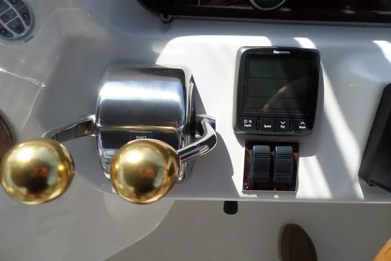 Slide: The Image of Control panel of 2000 Sea Ray 380 Aft Cabin with throttle and Raymarine display. - 20