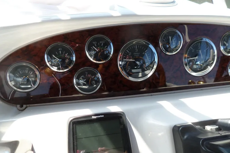 Slide: The Image of Dashboard of 2000 Sea Ray 380 Aft Cabin with gauges and Raymarine display. - 21