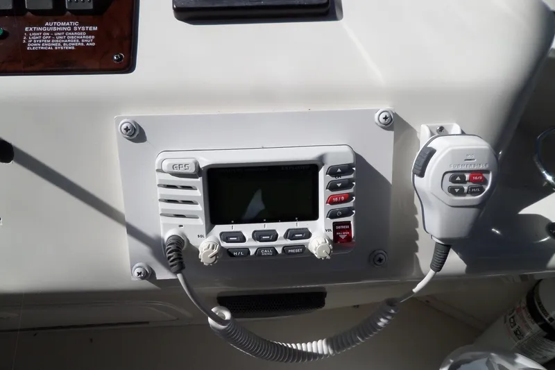 Slide: The Image of Control panel of a 2000 Sea Ray 380 Aft Cabin boat with communication equipment. - 27