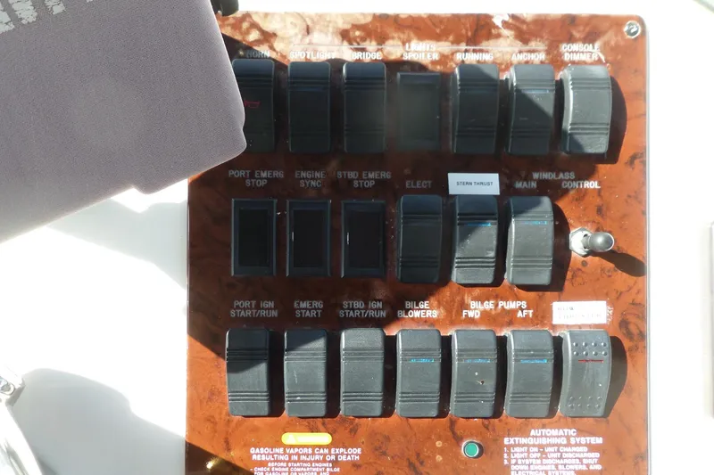 Slide: The Image of Control panel of a 2000 Sea Ray 380 Aft Cabin boat with various switches. - 28