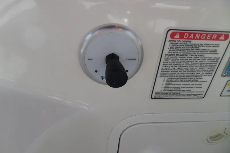 Slide: The Image of Control panel on a 2000 Sea Ray 380 Aft Cabin with safety warning label. - 31