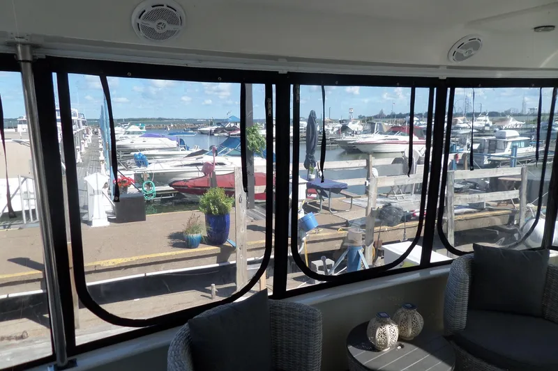 Slide: The Image of View from 2000 Sea Ray 380 Aft Cabin, overlooking marina with boats and clear sky. - 38