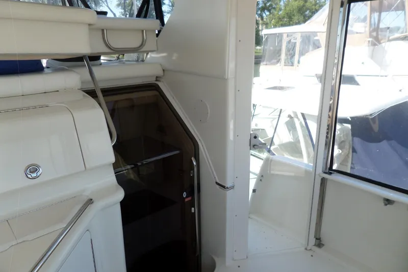 Slide: The Image of 2000 Sea Ray 380 Aft Cabin interior with stairs and seating area. - 40
