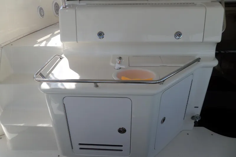 Slide: The Image of 2000 Sea Ray 380 Aft Cabin yacht interior with sink and storage area. - 41