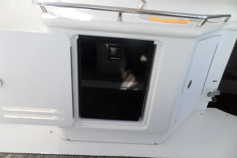 Slide: The Image of 2000 Sea Ray 380 Aft Cabin yacht interior with built-in mini fridge. - 43