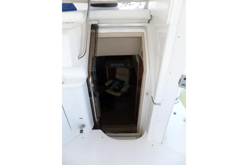 Slide: The Image of 2000 Sea Ray 380 Aft Cabin interior entrance with visible seating area. - 46