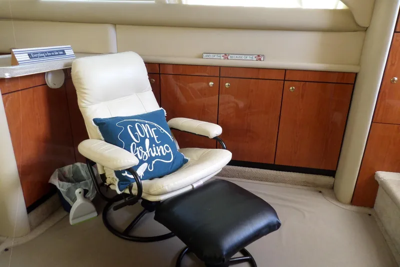 Slide: The Image of Interior of 2000 Sea Ray 380 Aft Cabin with chair and "Gone Fishing" pillow. - 50