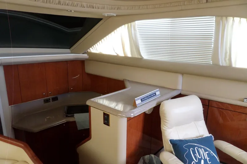 Slide: The Image of Interior of 2000 Sea Ray 380 Aft Cabin yacht with wood cabinetry and plush seating. - 51