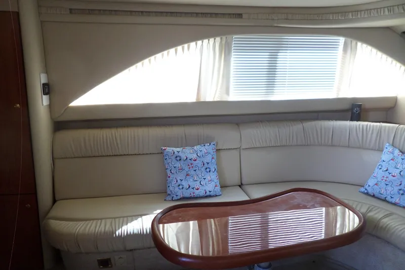Slide: The Image of Interior of 2000 Sea Ray 380 Aft Cabin with beige seating and decorative pillows. - 54