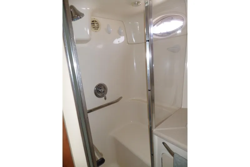 Slide: The Image of Shower area in 2000 Sea Ray 380 Aft Cabin yacht, featuring glass door and modern fixtures. - 70