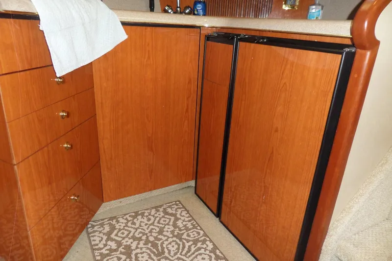 Slide: The Image of Wooden cabinetry in the 2000 Sea Ray 380 Aft Cabin yacht interior. - 76