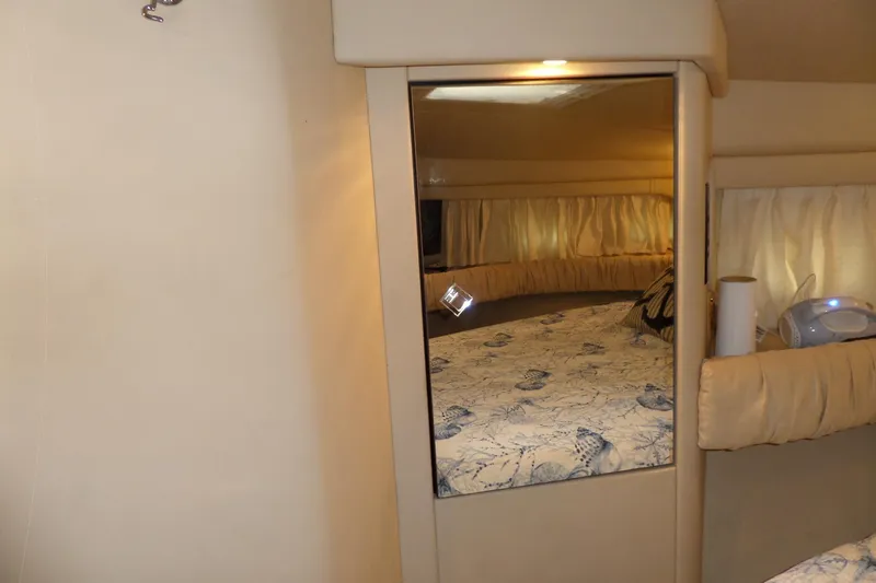 Slide: The Image of Interior of 2000 Sea Ray 380 Aft Cabin with mirrored closet and cozy bed. - 86