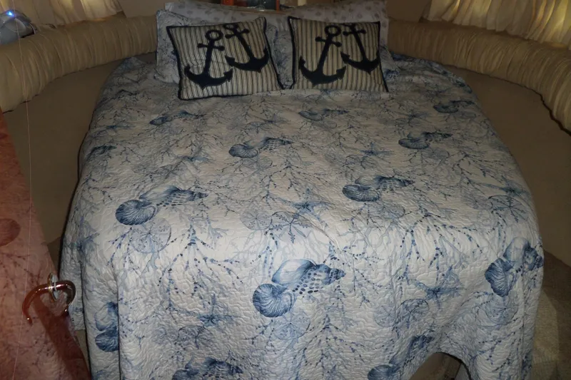 Slide: The Image of Cozy cabin bed with nautical-themed bedding in 2000 Sea Ray 380 Aft Cabin yacht. - 98