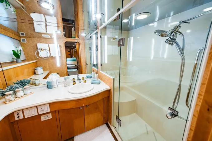 Slide: The Image of Luxurious 1995 Hatteras Motor Yacht bathroom with modern fixtures and glass shower. - 39