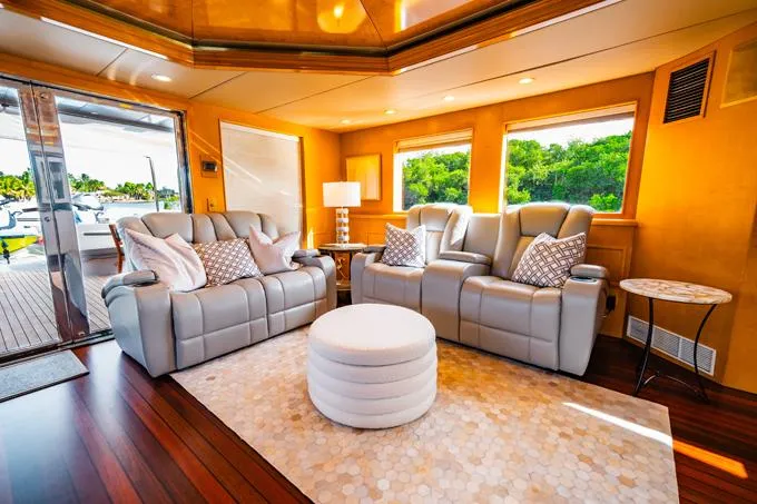 Slide: The Image of Luxurious 1995 Hatteras Motor Yacht interior with plush seating and elegant decor. - 41