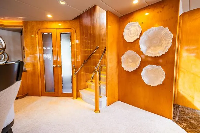 Slide: The Image of Luxurious 1995 Hatteras Motor Yacht interior with elegant decor and wooden finishes. - 8