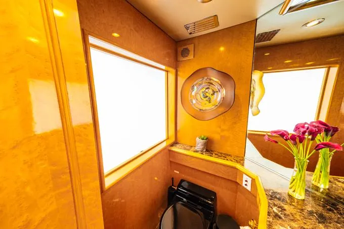 Slide: The Image of Luxurious bathroom interior of 1995 Hatteras Motor Yacht with elegant wood finish and floral decor. - 10