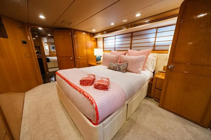 Slide: The Image of Luxurious bedroom interior of 1995 Hatteras Motor Yacht with elegant wood finishes. - 28