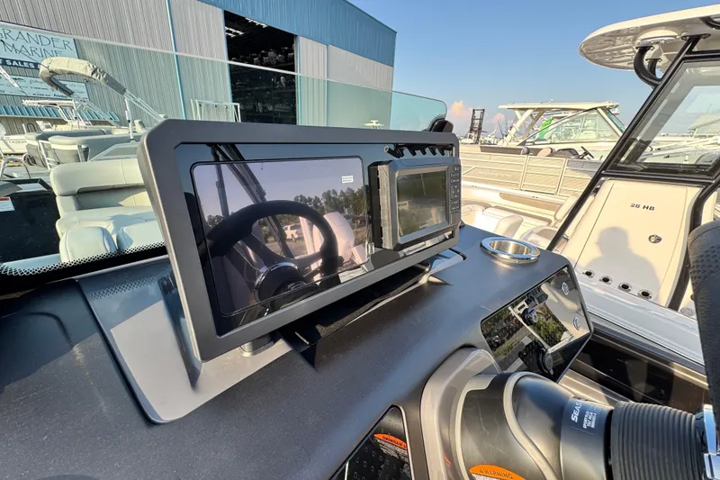 Slide: The Image of Helm of 2026 Bennington 24 MSB boat with modern navigation equipment. - 14