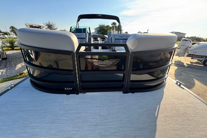 Slide: The Image of 2026 Bennington 24 MSB pontoon boat, rear view, on a sunny day. - 6