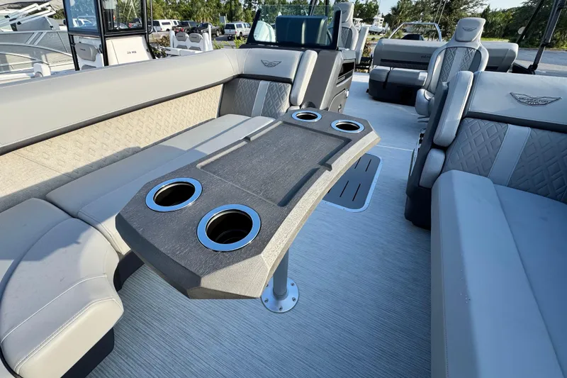 Slide: The Image of 2026 Bennington 24 MSB boat interior with seating and cup holders. - 8