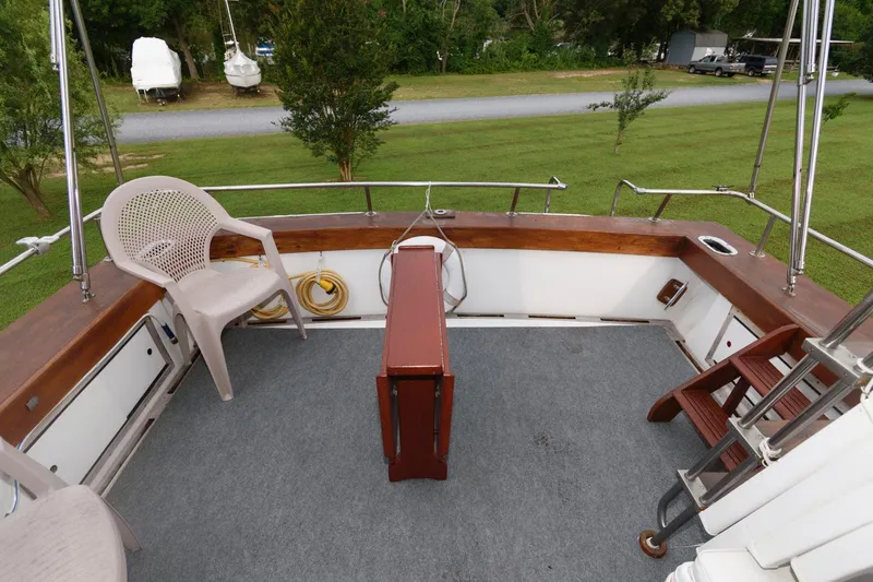 Slide: The Image of 1977 Pequod 34 Sportfish boat deck with seating and storage. - 10