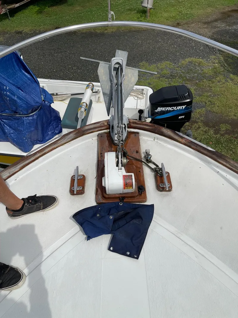 Slide: The Image of 1977 Pequod 34 Sportfish boat bow with anchor and Mercurty outboard motor. - 3