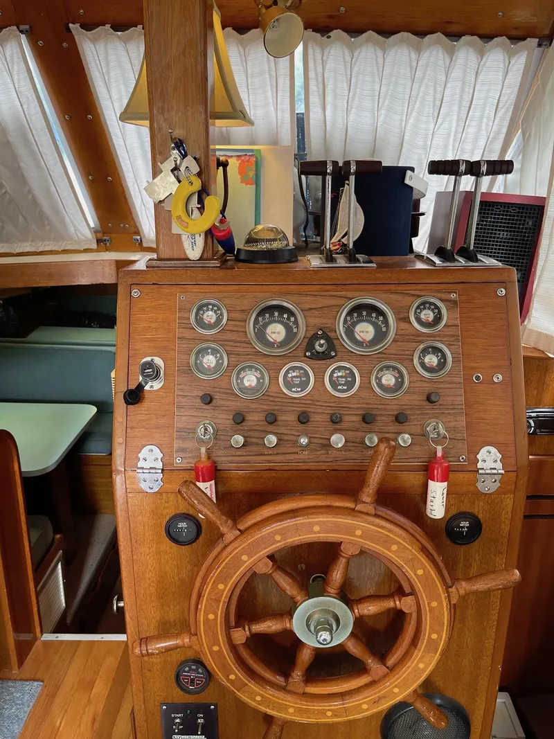 Slide: The Image of 1977 Pequod 34 Sportfish boat helm with wooden steering wheel and instrument panel. - 31