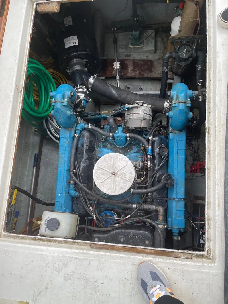 Slide: The Image of 1977 Pequod 34 Sportfish engine compartment with blue marine engine. - 45